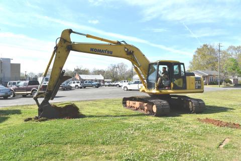 Shown is Chris Whitley, chief jailer for the Fayette County Sheriff Department as he takes the first ceremonial scoop of dirt toward the site preparation.