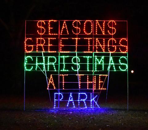 Shown is a sign that greets visitors to "Christmas at the Park."
