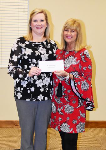 Tracy Kelly of Alabama Power (left) is shown presenting a $1,000 grant to Councilwoman Linda McCraw.