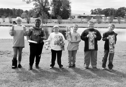 Shown are the winners in the fishing rodeo. From left: Big Fish winner Alyssa Britnell, who received a lifetime Alabama fishing license from the Alabama Department of Conservation; Most Fish (tie): Jayce Smith and Samuel Pasley; and runner-ups in the Big Fish contest: Lennox Gibson, Noah Pasley and Kelton Parker.