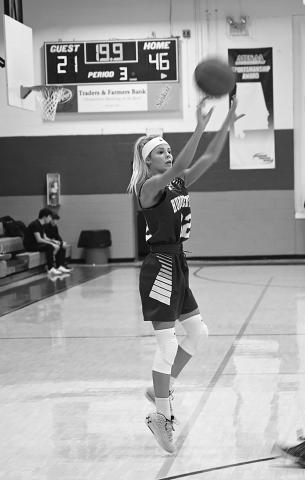 Haylee Pollard shoots a three-point shot for Hubbertville.