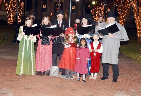 Pictured are carolers singing during "An Old Fashioned Christmas."