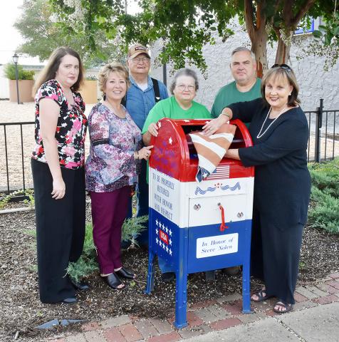 A depository box for worn, faded and torn U.S. Flags was dedicated and displayed at Flag Park in downtown Fayette on Friday, July 23 by the Fayette Beautification Committee. Shown from left: Stephanie Butler, Kathy Bordelon, John Brasher, Doris Brasher, Steven Nolen and Bonita Logan.