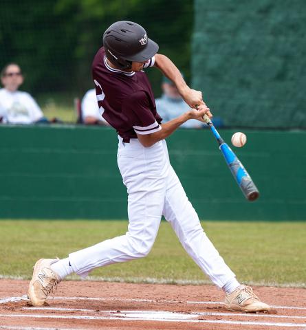 Cade Fisher is shown getting a hit for Hubbertville.