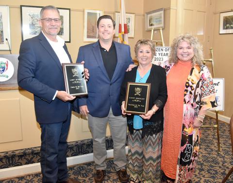 The Fayette Area Chamber of Commerce presented awards at its June 6 luncheon. Shown from left: Mark Montague (accepting the “Citizen of the Year” award for Larry Humber), Fayette Chamber President Russ Taylor, Kathy Bordelon (“Volunteer of the Year”) and Fayette Chamber Director Emily Montague.