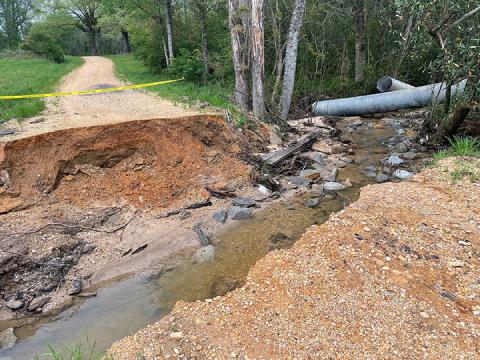 Morris Loop Road, pictured here, suffered severe damage after storms swept through the county.