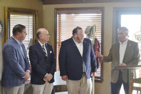 Pictured at the ribbon-cutting ceremony at Richard Arthur Field are, from left, State Sen. Matt Woods, U.S. Rep. Robert Aderholt, State Rep. Brian Brinyark and Fayette Mayor Rod Northam. The officials joined local, state and federal leaders in celebrating the completion of a new hangar and apron expansion designed to support economic development and future growth in Fayette County. 