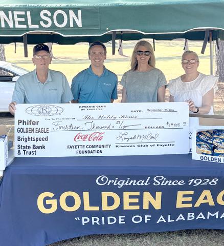 The Kiwanis Club of Fayette County raised over $14,000 for the Weldy Home for Girls. Pictured left to right are Don Bell (Kiwanis), Logan McCool (Kiwanis), Heather Collins (Weldy Home), and Belinda Watts (Kiwanis).