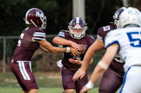 Hubbertville quarterback Blaize Wakefield hands the ball off to Hutch Miles during the Lions’ 50-0 homecoming victory over Brilliant on Sept. 4. Miles helped get the Lions off to a fast start, scoring on a 42-yard run on Hubbertville’s opening possession.