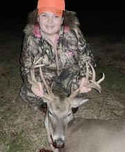 Shown is Audrey Clelland with 17-point deer she killed.