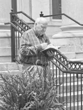 Dr. John Killian, Director of the Fayette County Baptist Association, reads from 1Timothy chapter two at the county courthouse May 7. 