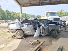A heavily damaged 2004 Nissan Sentra sits following a single-vehicle crash Sunday, Aug. 23, on Fayette County Road 23 near Dodson Circle Road. The driver was pronounced dead at the scene. 