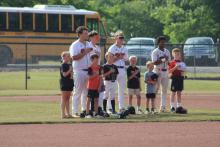 Fayette County High School players were joined by future Tigers from local park and recreation teams during pregame introductions before their opening-round play-off series against Dora.