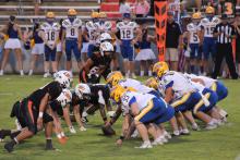 Fayette County’s defensive line prepares for the snap in the game against Curry on Friday, Sept. 11. The Tigers held the Yellow Jackets scoreless and limited Curry to 158 yards of total offense in a 47-0 victory. 