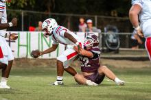 Hubbertville’s Brayden Hill sacks Berry quarterback Zack Hollingsworth.